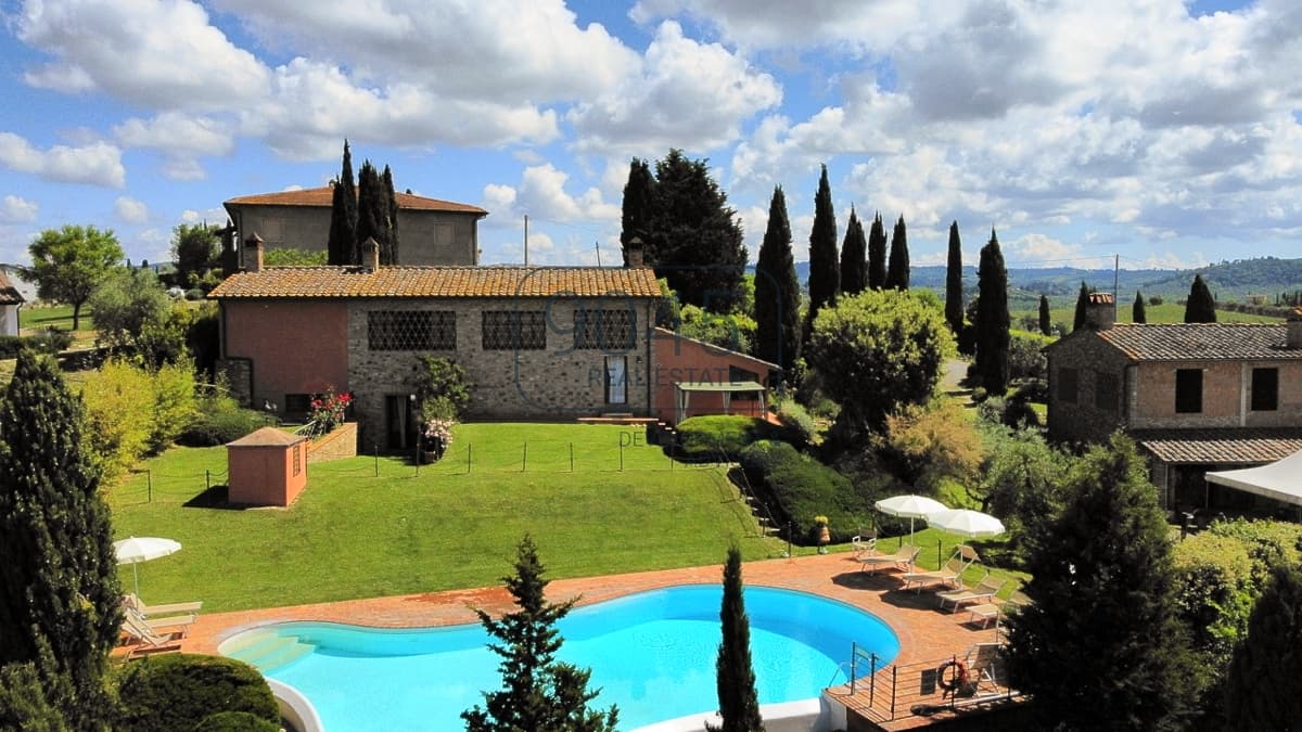 Tuscan estate with agritourism, an infinity pool, and panoramic views stretching all the way to San Gimignano, photo 1 of 46