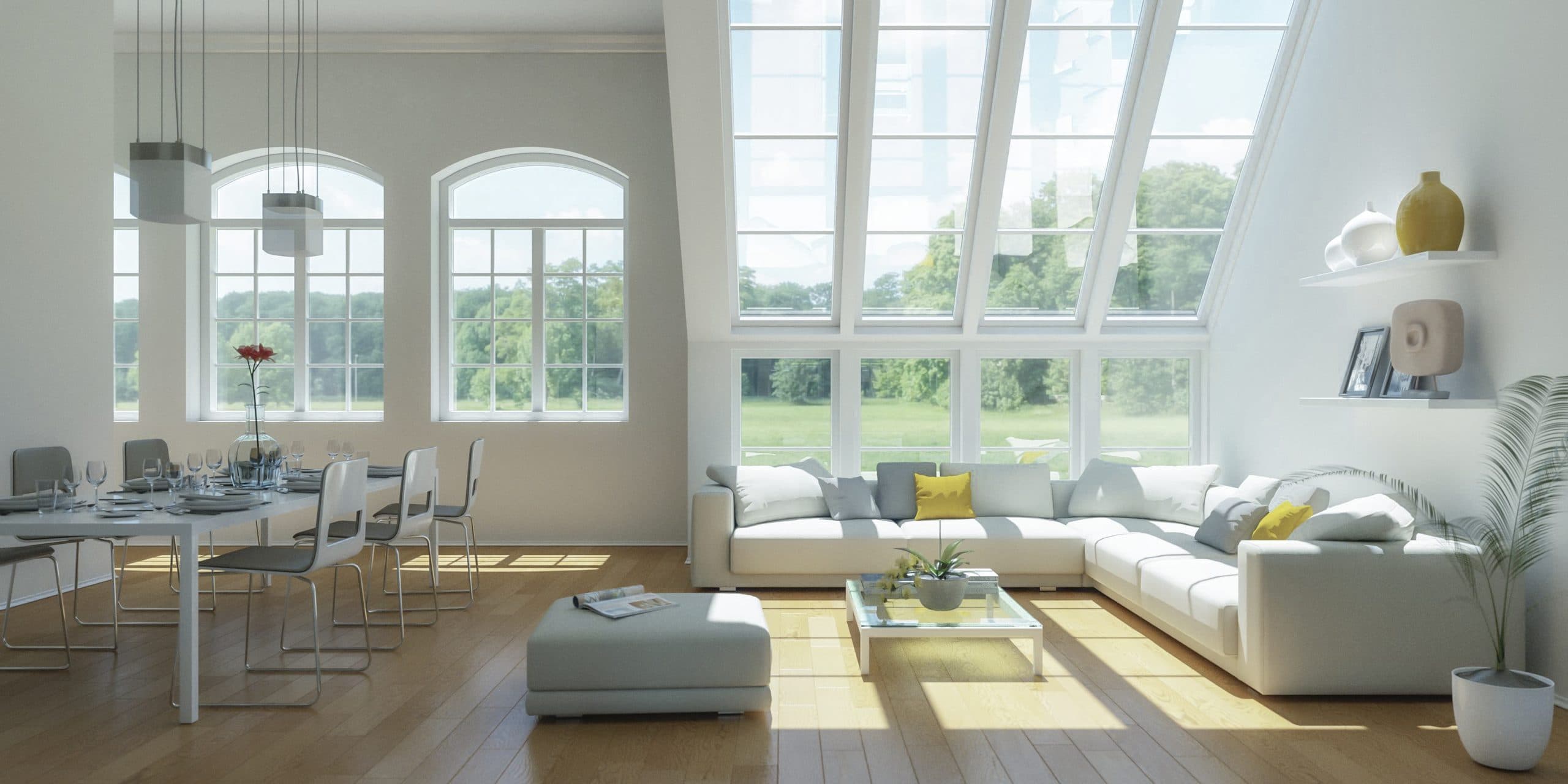 Bright open plan living room with white sofas, arched windows and parquet flooring