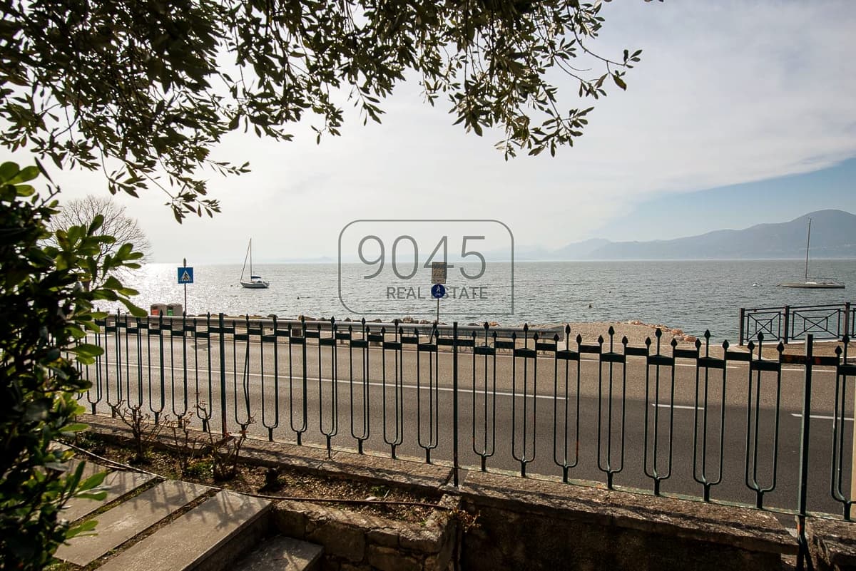 Charming terraced villa with stunning lake views and private garden in Torri - Lake Garda in Torri Del Benaco, property offered by 9045 REAL ESTATE